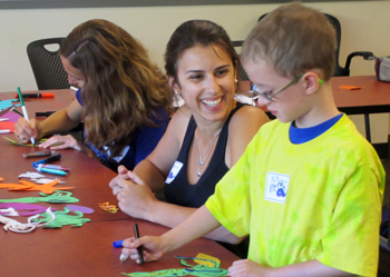 Laura working with and elementary student