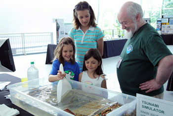 Mick Spillane with tsunami demonstration