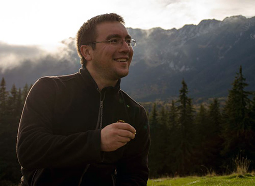 Cristi with mountains behind him