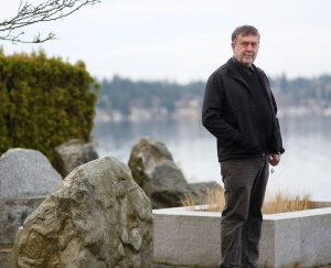 Portrait of Kevin Wood with lake in the distance.