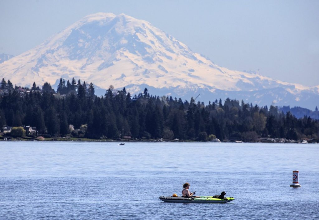 Kayaker with Mt Rainier in the background