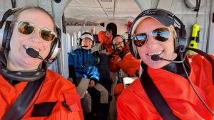 Selfie of a group of crew members aboard a small NOAA aircraft.