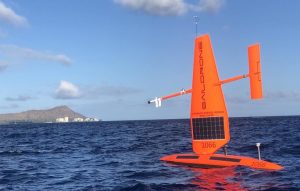 An autonomous vehicle called a SailDrone on open ocean.