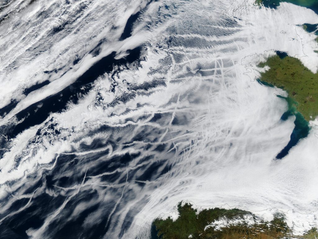 A satellite image in which white cloud-like streaks are from ships, which emit sulfate aerosols that can be toxic to humans and the environment. Aerosols also make the clouds more reflective.