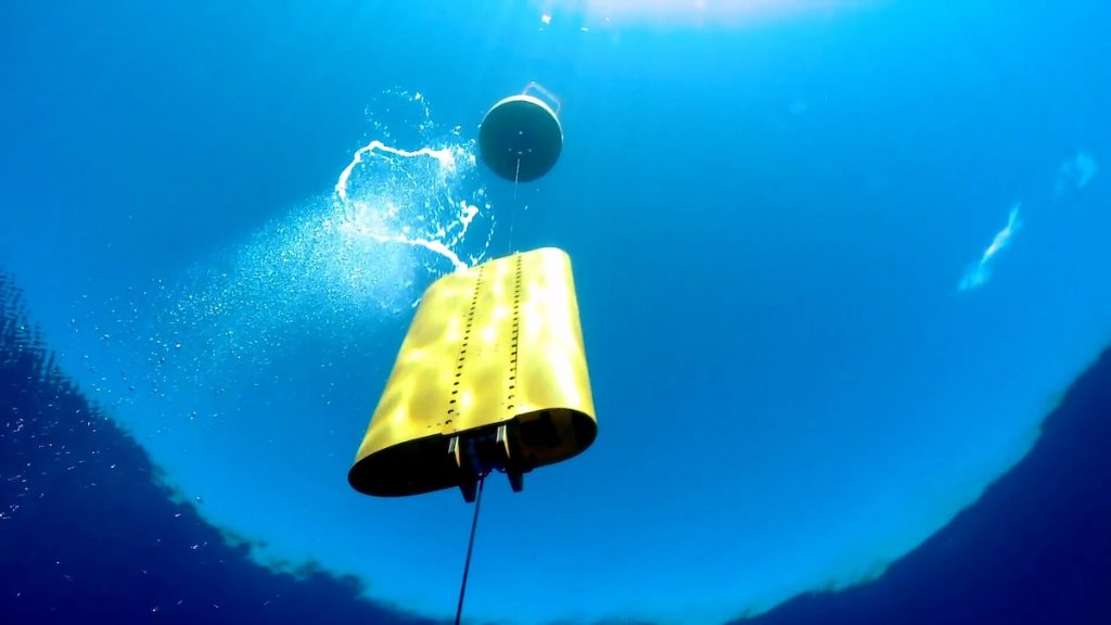 A wirewalker as seen from underwater. It looks like a yellow box on a metal wire.