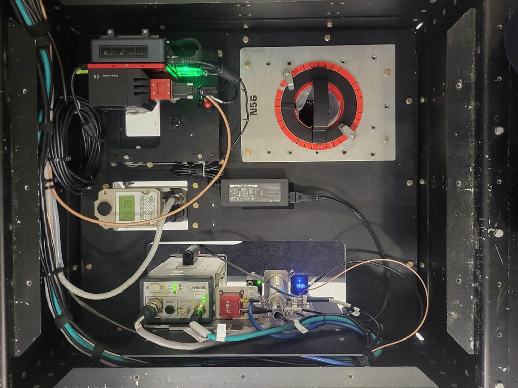 Close-up of the research crew's instrument bay. Several wires are connected to a variety of sensors and equipment. 