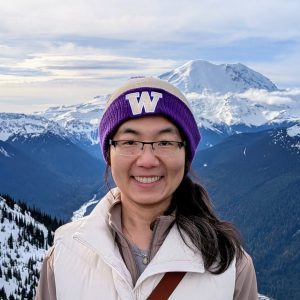 Headshot of Jiaxu Zhang wearing a University of Washington beanie with Mt Rainier in the background.