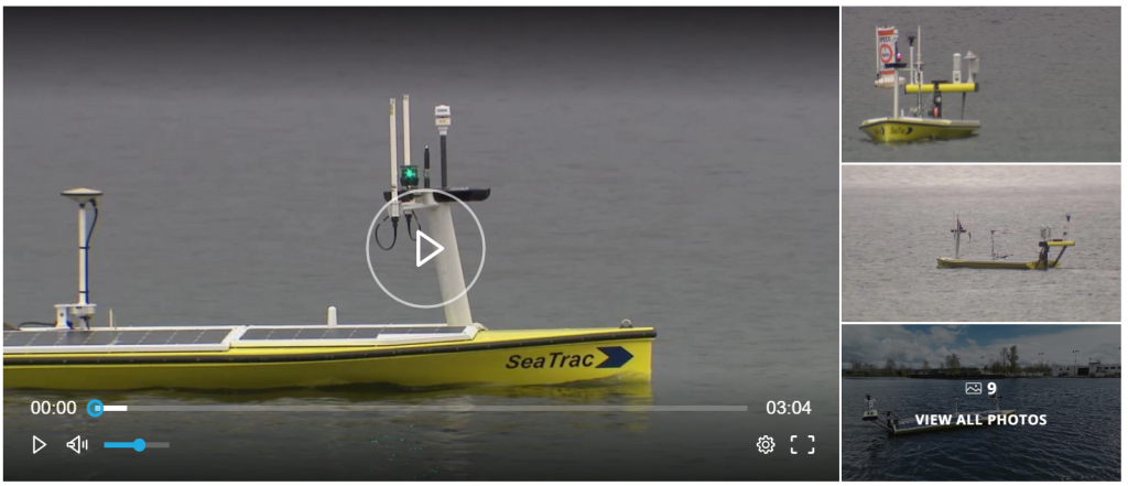 Screenshot of a video player, showing a still image of an autonomous boat on Lake Washington.