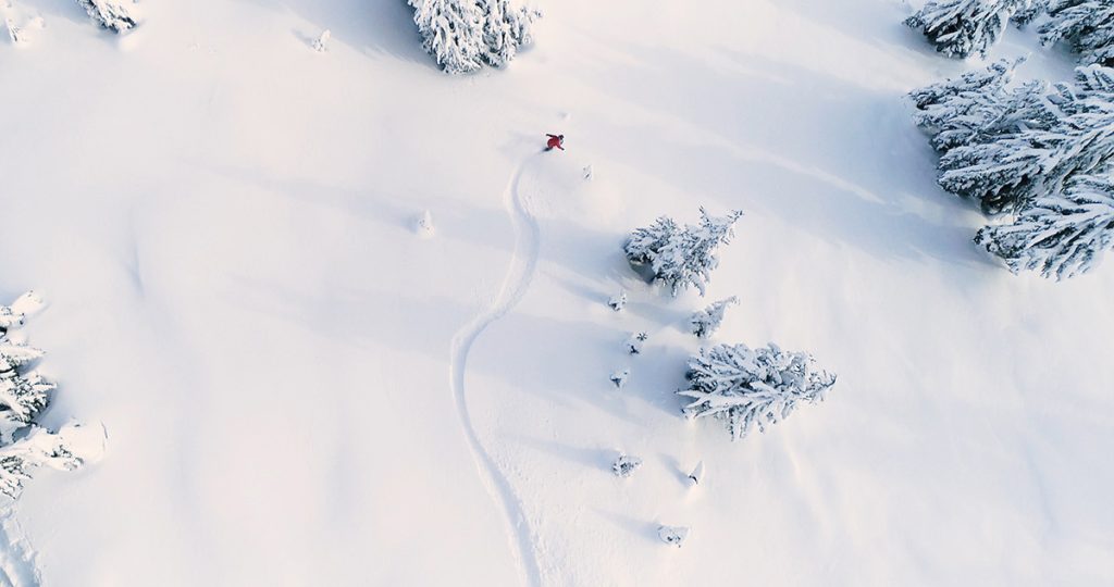 Aerial shot of a skier in powdery snow